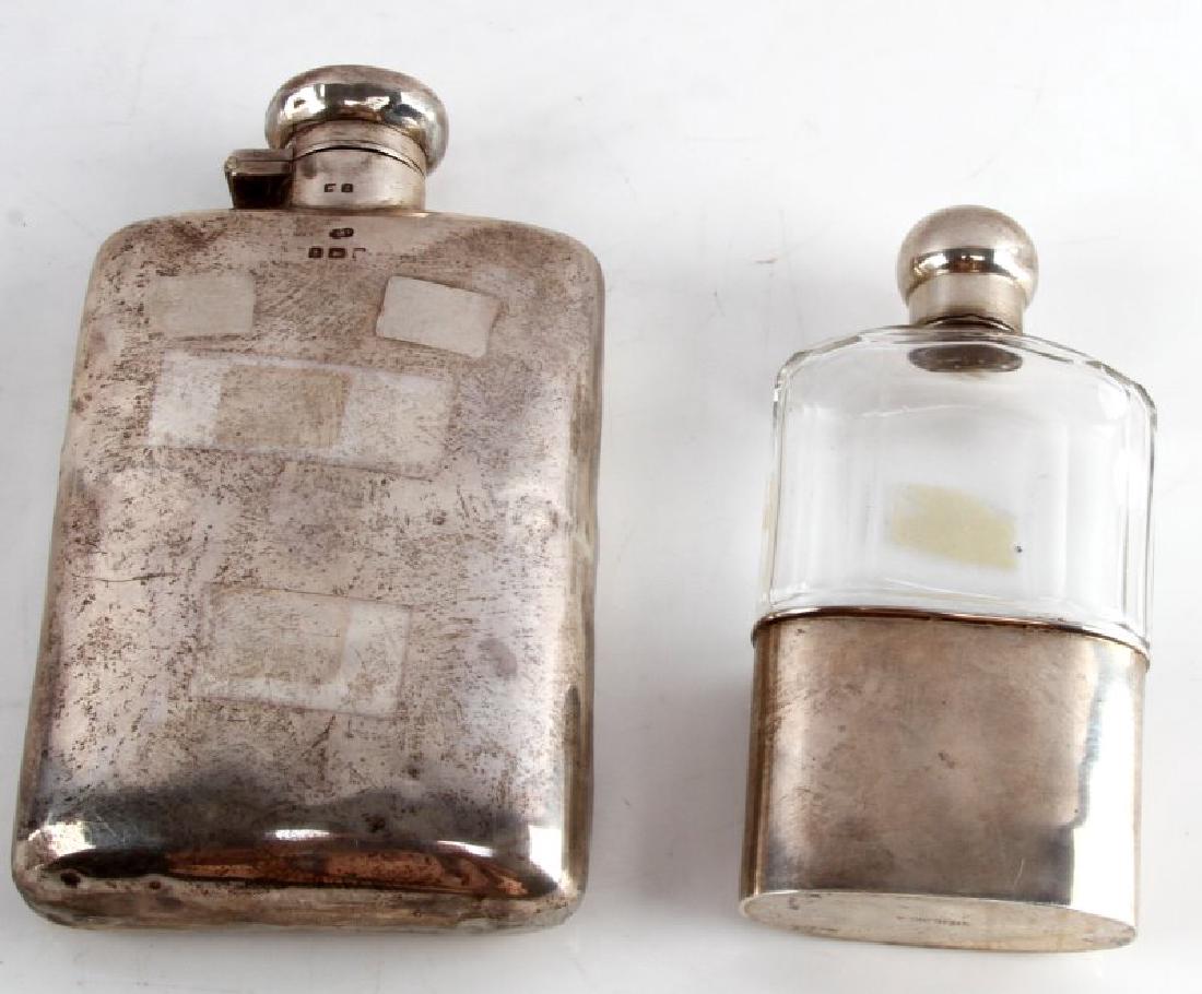 LOT OF 2 ANTIQUE HALLMARKED STERLING SILVER FLASKS: The larger flask is hallmarked Deakin & Francis from 1895 (Birmingham) and measures approximately 4" by 5 3/4". Has sticker residue from previous price tag. The second is marked "STERLING-A" on the bo