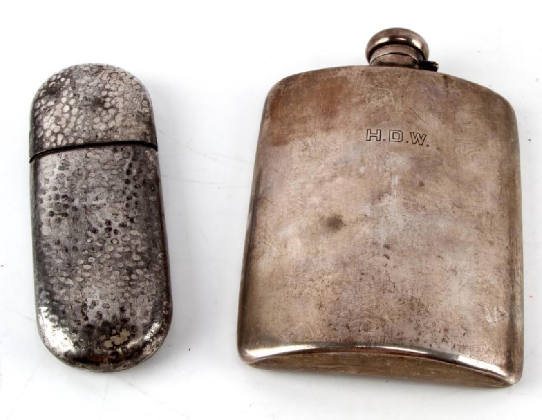 LOT OF 2 ANTIQUE FLASKS STERLING AND SILVER PLATE: The larger measures approximately 4 1/2" by 5 1/4", and is marked near cap "STERLING". Cork is flaking. From of flask is engraved "H.D.W." The second measures approximately 2" by 5 1/2". Marked beneat