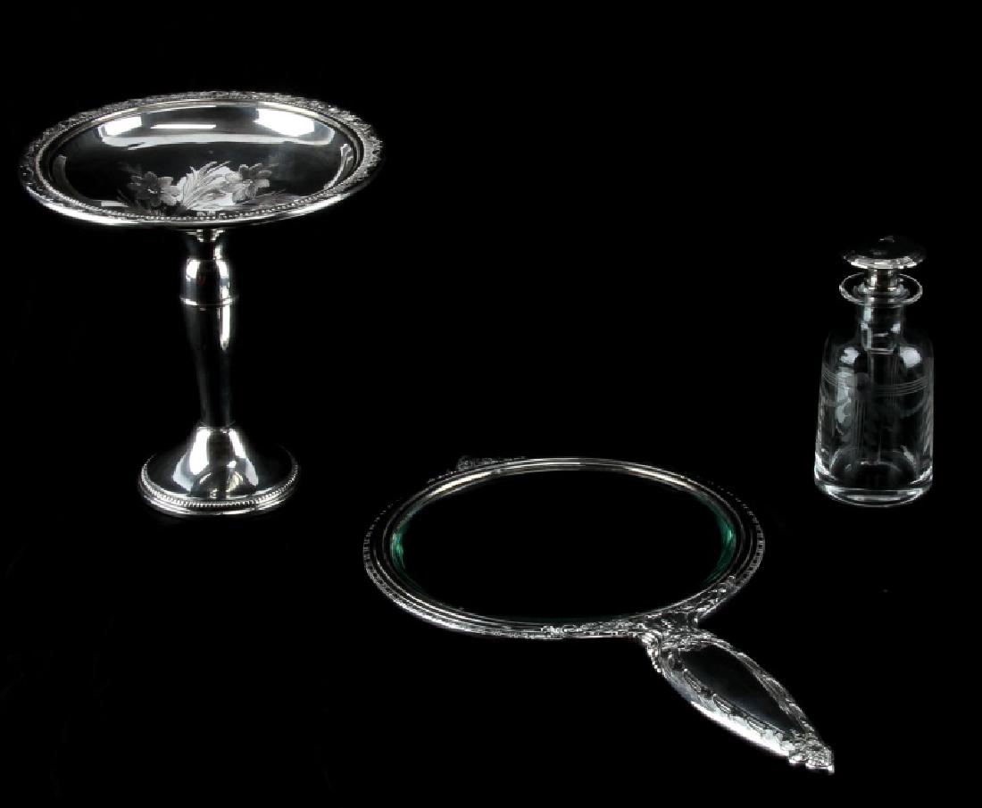3 PC STERLING SILVER LOT WHITING MIRROR PERFUME: 3 piece sterling silver lot. One Frank M. Whiting pedestal compote dish (5.5 by 5.5 inches) (weighted and re-enforced 199). One sterling hand mirror with engraved floral design (11 inches). One etched
