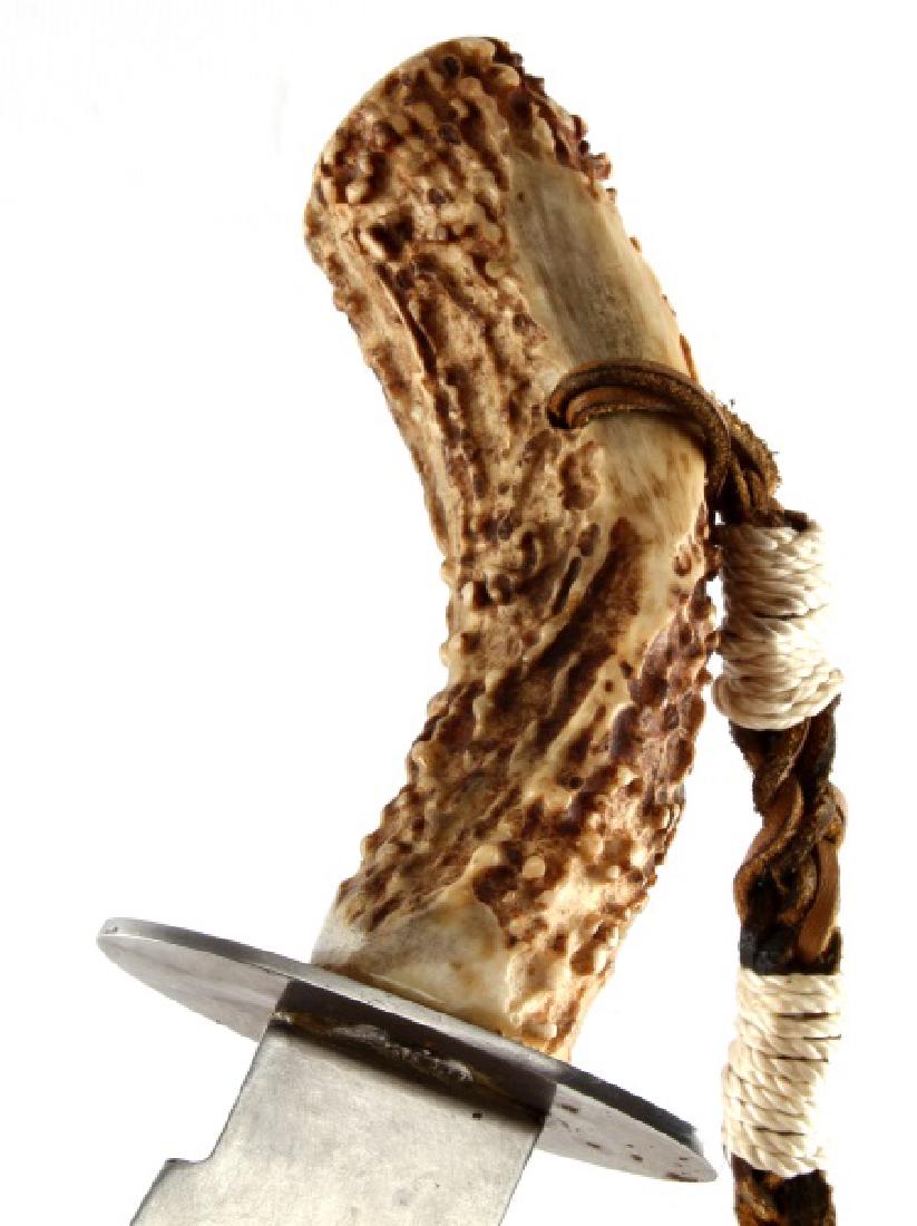 LARGE ANTLER HANDLE DISPLAY KNIFE W LEATHER SHEATH: Large antler handle display knife. Comes with leather sheath that has antler pieces displayed. Blade in very good condition. Blade measures 9 and 1/2".