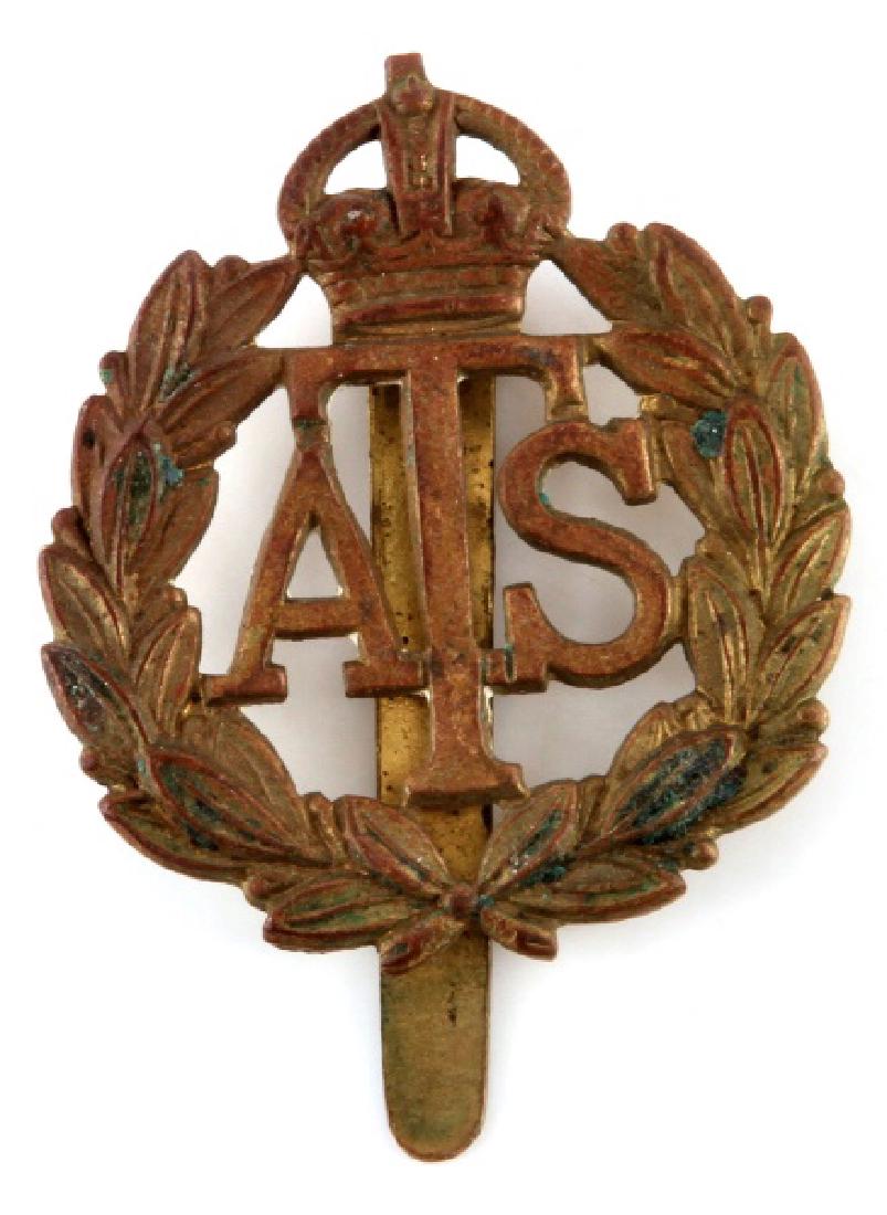 ANTIQUE BRASS WWII BRITISH OFFICER CAP BADGE ATS: Brass (?) WWII British Officer's cap badge. "ATS" (Auxillary Temtorial Service) Measures approx. 2" x 1.25". Some patina and verdigris present.