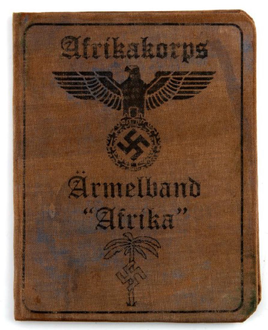 GERMAN WWII 3RD REICH AUSWEIS PANZER PARTICIPANT: German WWII Third Reich period Ausweis (identification document) of a Panzer participant of the Africa campaign. Some age wear present. Stamps, handwriting, and photo inside. Measures approx. 5"x4" (f