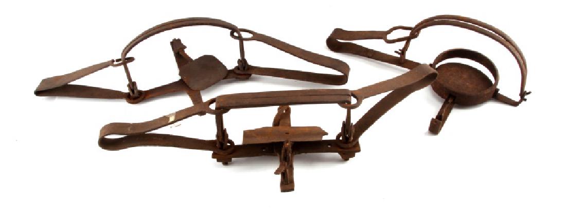 ANTIQUE LOT OF 3 ANIMAL TRAPS TWO BEAR TRAPS: Hand forged traps. They measure between 16" to 24". In good condition with general antique wear.
