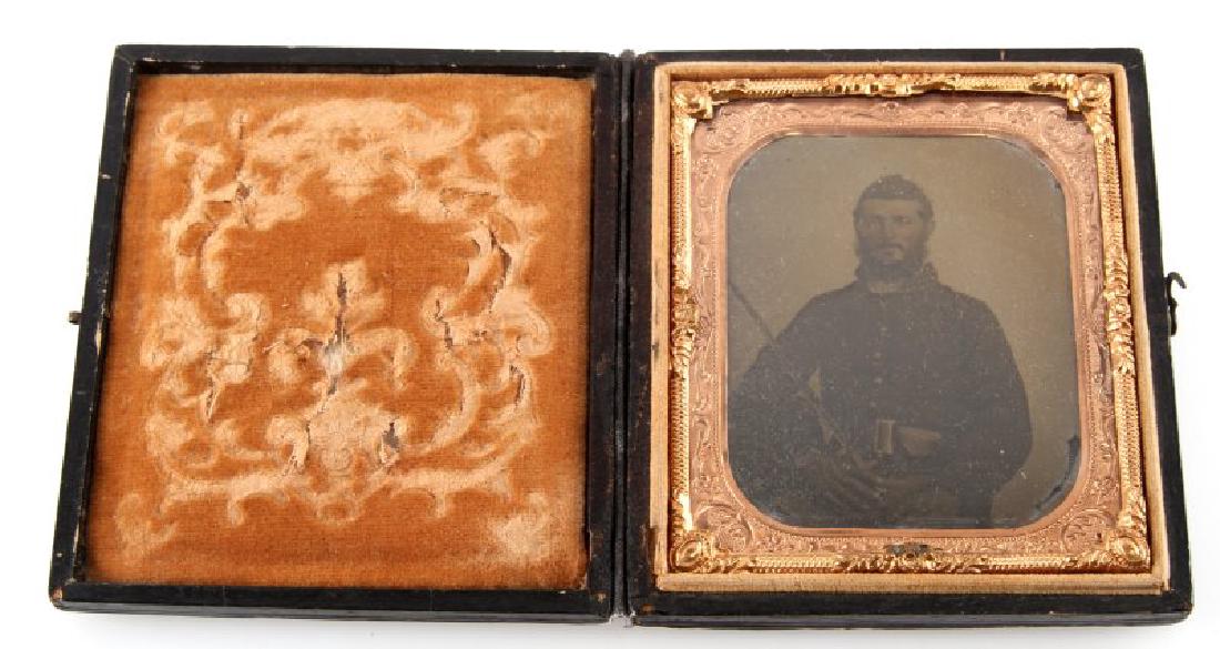 CIVIL WAR AMBROTYPE PHOTO RIFLEMAN W BAYONET: Avery fine example of soldier wearing Rifleman 4 piece buckle, also holding sword bayonet, the photograph is a 1/6 plate and contained in a patriotic Union case.