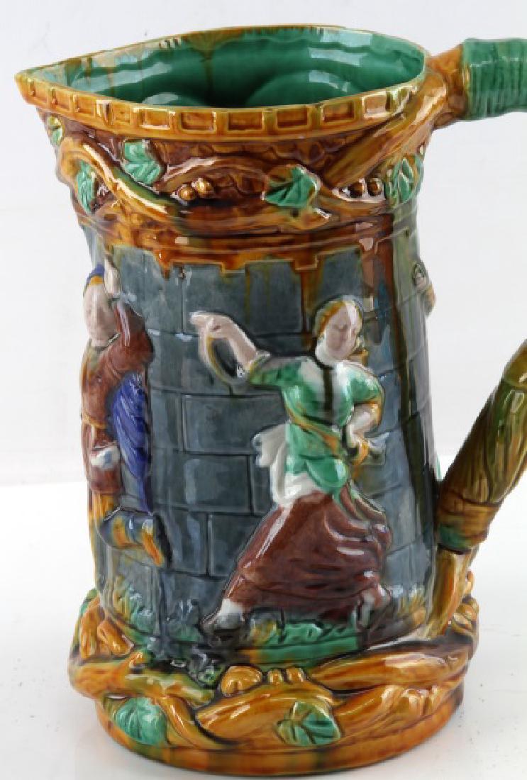 ANTIQUE VICTORIAN BRITISH MAJOLICA PITCHER DANCERS: 9 1/2" possible Victorian era British Boer war majolica pitcher. Unmarked. Depicts various people dancing in front of a gray brick wall. Very good condition with no nics, chips, or crazing.