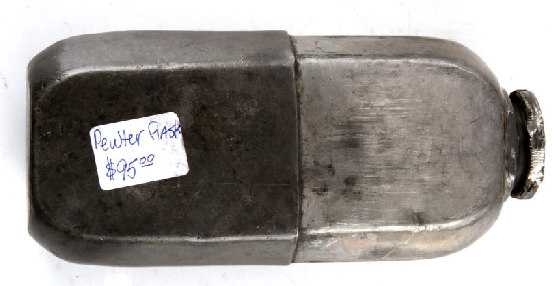19TH CENTURY PEWTER WHISKEY FLASK: Unmarked flask with screw cap and removable cup. Measures 5" long by 2 1/2" wide. In good condition, with some cracking to sides of cup. Has previous price sticker.