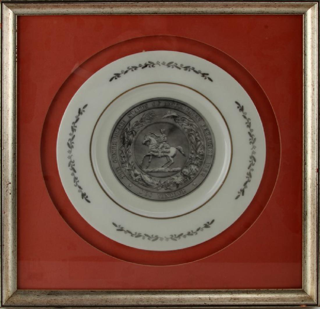 FRAMED PLATE WITH CONFEDERATE STATE SEAL FEB 1862: Framed 11'' diameter porcelain plate with engraved image of confederate seal with surrounding statement which reads " The Confederate States Of America : 22 February 1862 : Deo Vindice ". Plate is in 