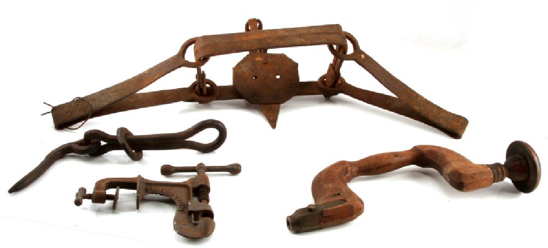 LOT OF ASSORTED ANTIQUE IRON BEAR TRAP AND TOOLS: One bear trap that measures approximately 25" long. Also includes an antique nutcracker (which reads, "PERFECTION NUT CRACKER CO"), and iron hook. All in good condition with antique wear and rusting.