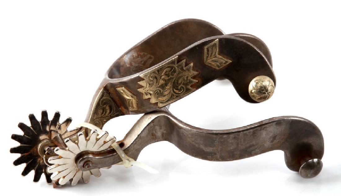 THREE PAIRS OF ANTIQUE WESTERN COWBOY SPURS: Two pairs in very good condition, and one pair in fair condition, with a high amount of rust. Size of rowels range from 1 1/2" to 3" in diameter.