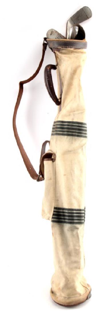ANTIQUE GOLF CLUBS AND BAG ALFRED I. DUPONT ESTATE: Antique golf clubs and bag. Includes: Tufhorse canvas bag, 2 balls (Spalding and Pinnacle), Invincible 51P putter, T. Stewart putter, Pirate 7 iron, and a Pirate 2 iron. Condition commensurate with ag
