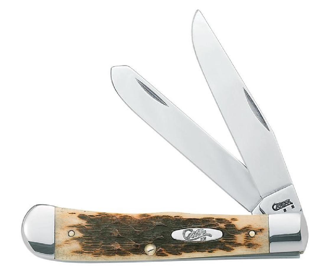 CASE XX CUTLERY 000163 AMBER TRAPPER KNIFE: One Case 000163 amber trapper. Item is new in box.