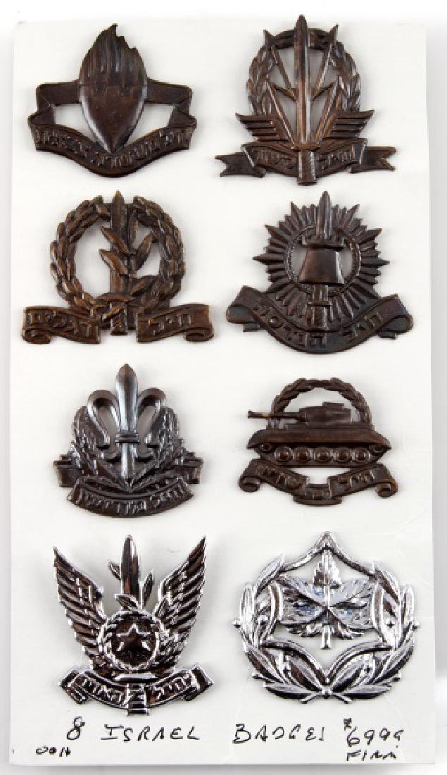 LOT OF 8 ASSORTED ISRAELI CAP BADGES: Lot of eight (8) includes: Signal Corps, M.P., Engineers, Infantry, Armor, Intelligence, Sergeant Major, and Air Force. All 8 badges come on one card, each measures approx. 2". All in very good condit