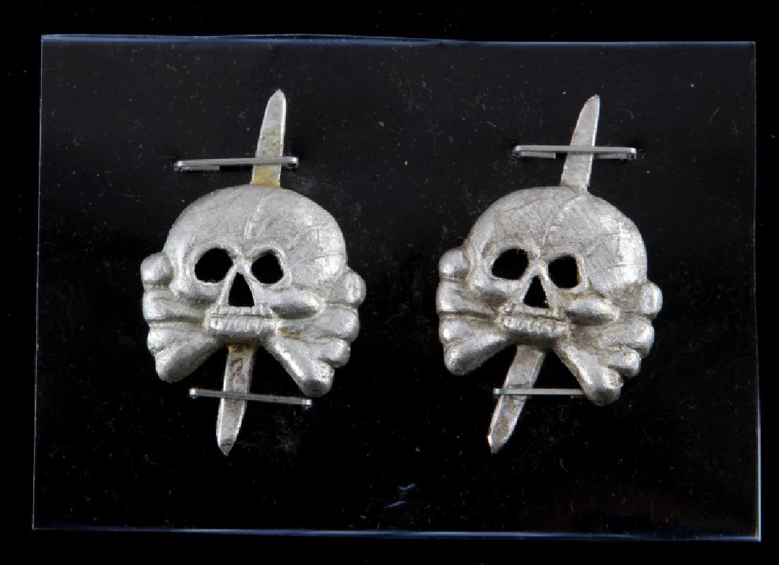 LOT 4 GERMAN WWII WAFFEN SS TOTENKOPF BADGES: Lot of four (4) German WWII Third Reich period Waffen SS Totenkopf badges - jawless (Panzer) variation. Unauthenticated. Sold "as is". Each badge measures approx 1.5" (end to end). This lot has a rese