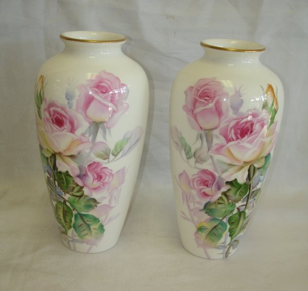 TWO NORITAKE CHINA ROSE PATTERN FLORAL VASES : Baked Porcelain decorated floral vases (2) : Noritake Bone China. Pink and white floral rose scene painted on white background suitable for up to four stems. 81/2 "tall. flange is 4 1/2"in diameter. N