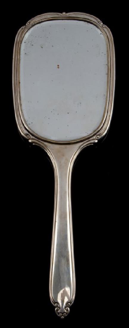 ADOLF HITLER MONOGRAMMED SILVER HAND MIRROR: Adolf Hitler monogrammed silver hand mirror. Features 800 stamp and hallmarks on front of handle. Minor tarnishing. Reverse displays the monogrammed letters AH. No cracks in mirror. Measures 12 1/4" i