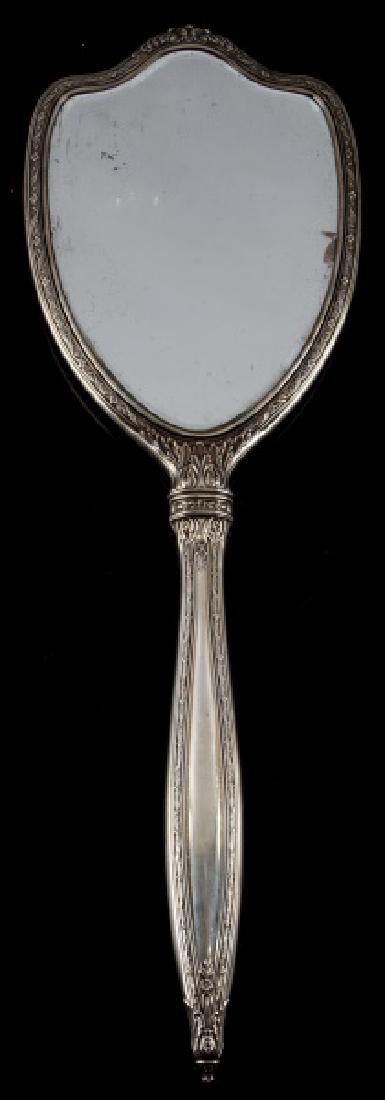 ADOLF HITLER SILVER MONOGRAMMED HAND MIRROR WWII: Adolf Hitler silver monogrammed hand mirror. Made in Germany during WWII. Displays AH monogram on reverse. Intricate floral design across entire piece. No cracks in mirror. Overall very good condition