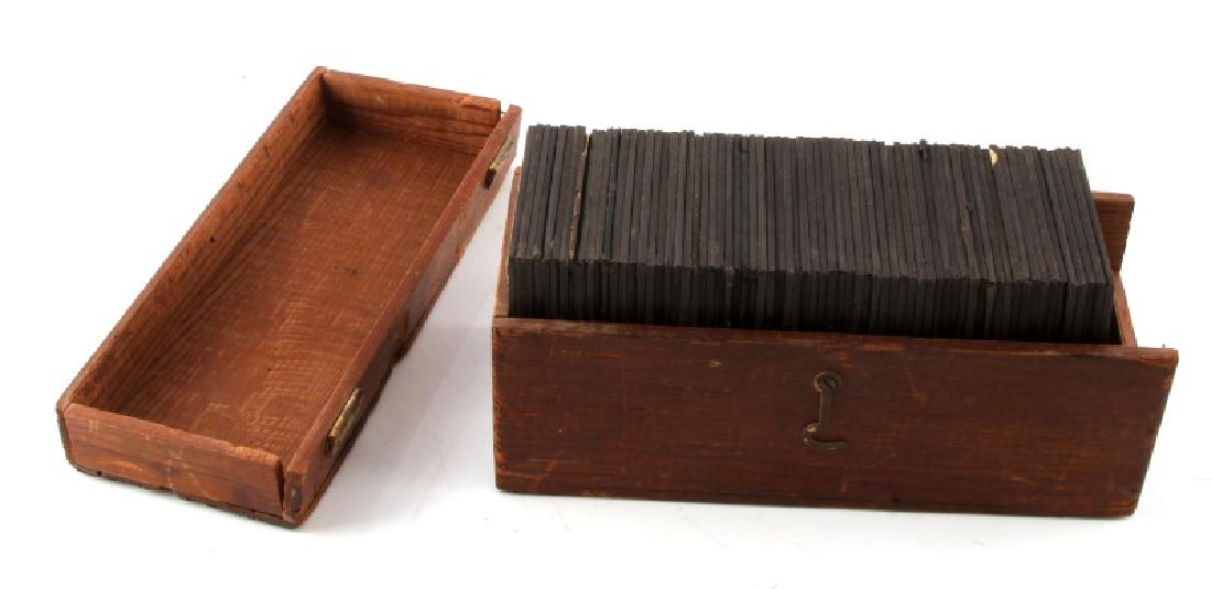 LOT OF 60 PLUS MAGIC LANTERN GLASS SLIDES: Early 20th glass slides, most of nature and the cosmos. Most in good to excellent condition, some cracked. Come in a wooden box with broken hinge--box in fair condition.
