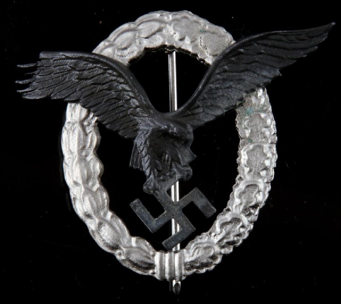GERMAN WWII LUFTWAFFE PILOTS BADGE: 2 piece construction. Thin vertical pin back. May have previously been repaired. Very good condition.