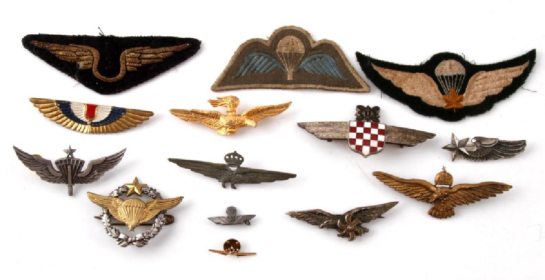 ASSORTED VINTAGE WING LOT PINS & PATCHES: Vintage and newer assorted wing lot of pins & patches. Includes: Netherlands Commemorative Pilot Wings, Para Rescue, French A.F. Para Rescue, Royal Crown (Italian?), and more.
