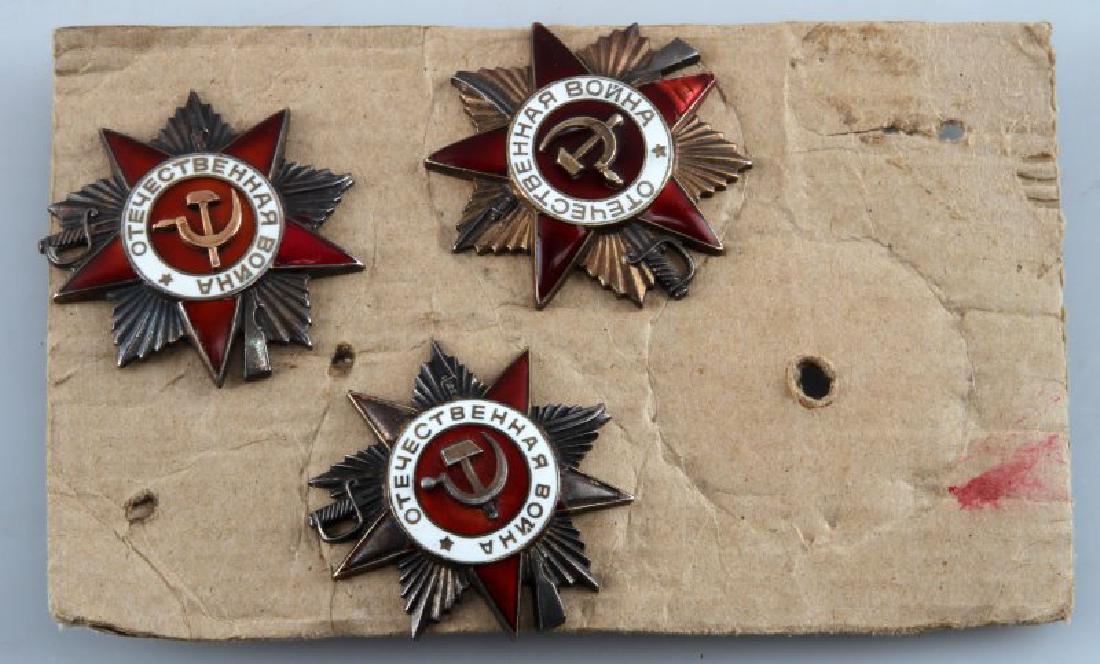 WWII SOVIET USSR PATRIOTIC WAR DECORATION LOT OF 3: 3 examples of the Soviet Order of the Patriotic War, First Class. Each award displays its serial number on the back behind the screw back attachment. The red enamel on two of the awards has been chipp