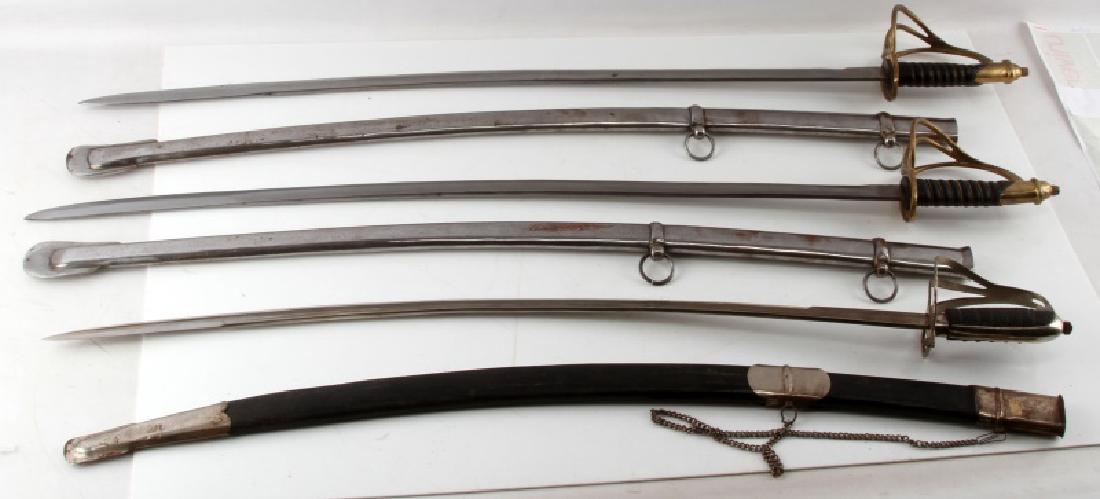 LOT OF 3 1840 CAVALRY DRAGOON SABERS W SHEATHS: Each measures approximately 40" overall, with blades that measure 35". All with sheaths, two with metal sheaths. All marked India--the other with the faux leather sheath has a highly decorated blade. 