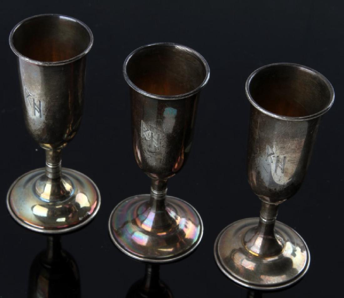 3 RICHARD HEIDRICH WINE CHALICES GERMAN WWII: German WWII 3 of Richard Heidrich's silver wine chalices. Each features the RH monogram displayed on exterior body. Stamped sterling on base. Silver weight alone is 39 grams. Measures 3 1/4" tall. Una