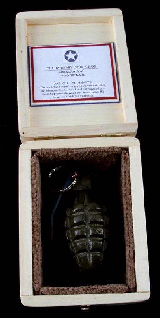 HAND PAINTED TRINKET BOX W WWII U.S. INERT GRENADE: Measures 6 1/2" by 5" and 2 1/2" deep. Comes with inactive fragment pineapple grenade. Signed J. Randy Smith.