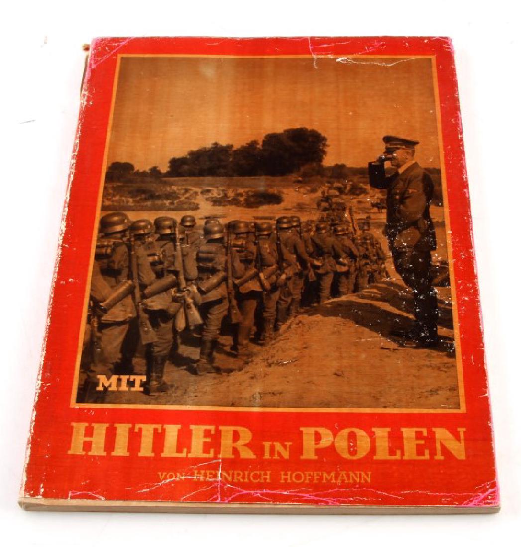 GERMAN WWII PHOTO ALBUM HITLER IN POLAND HOFFMANN: German WWII photo album "With Hitler in Poland" by Heinrich Hoffmann. Printed in 1939. Cover sleeve is worn. Book in very good condition. This lot has a reserve.