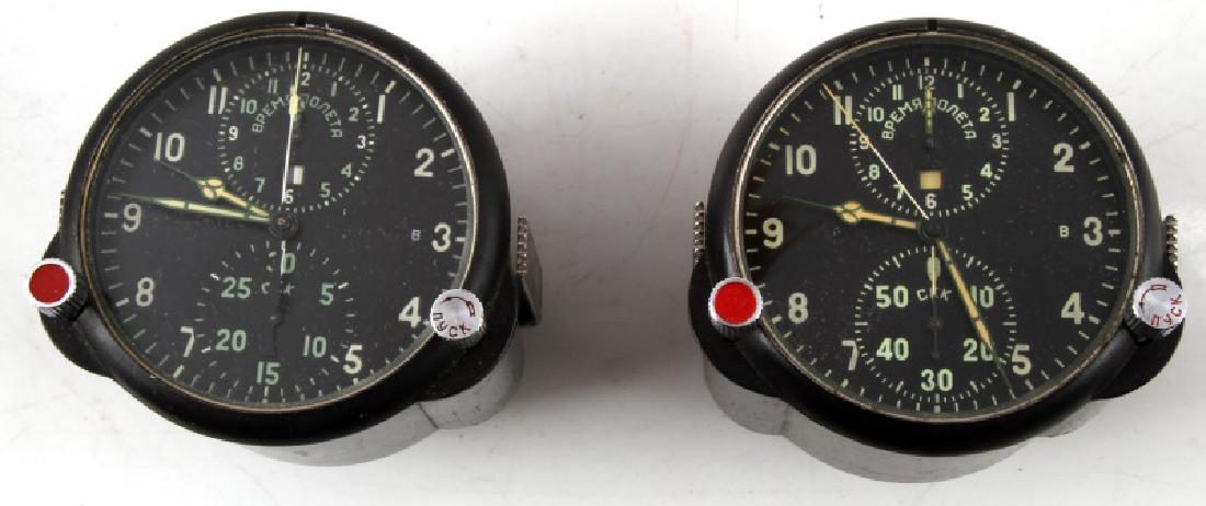 SOVIET RUSSIAN MILITARY AIRCRAFT CLOCK LOT OF 2: 2 Soviet AChS-1 aircraft cockpit chronometers. Hands and faces are luminescent for nighttime viewing. Devices are 3 1/2" in diameter x 3 3/4" in length and weighs 20.81 ounces each. Excellent conditio