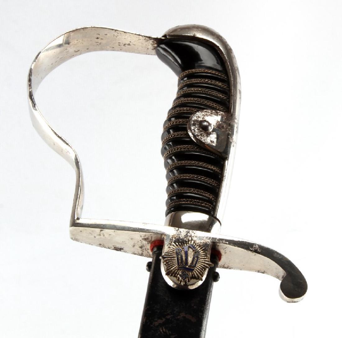 RLB LUFTSCHUTZ NCO SABER ERNST PACK & SOHNE RARE: Steel construction with black and silver wire grip, RLB sunburst crest to obverse langet, red leather washer, and black scabbard. Blade measures 34.5 inches and is maker marked. Blade has spotty finis
