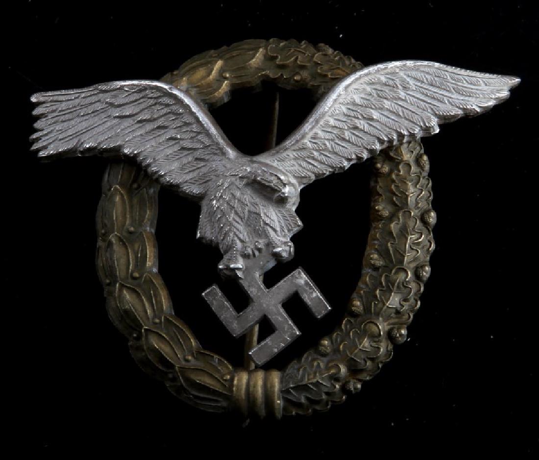 WWII GERMAN LUFTWAFFE PILOT OBSERVER BADGE: German WWII Luftwaffe Pilot Observer badge. Thin vertical pin back. Marked on reverse "J.E. JUNCKER BERLIN". VG condition.
