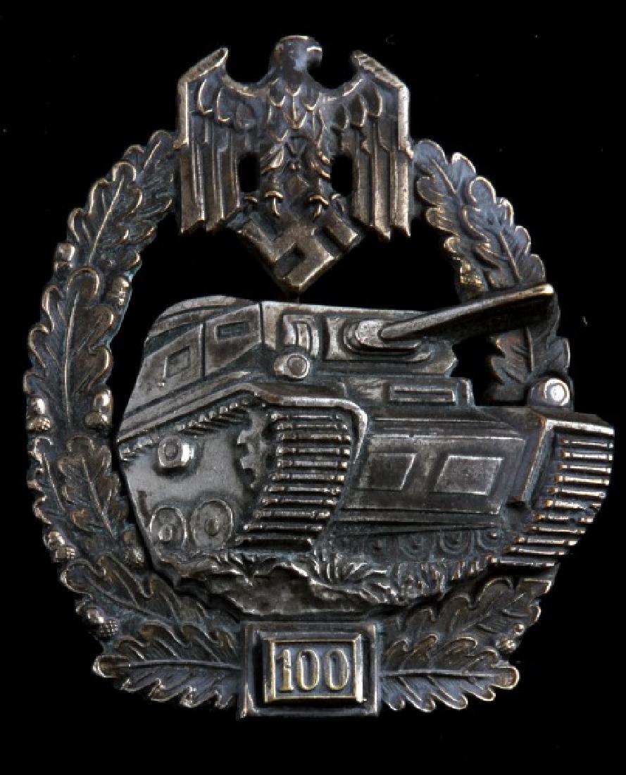 GERMAN WWII PANZER TANK 100 ASSAULT BADGE: Marked WWII German Panzer tank assault badge awarded for those who had successfully accomplished 100 tank engagements (skirmishes, battles etc...). Some gold wash remaining and visible as most has wor