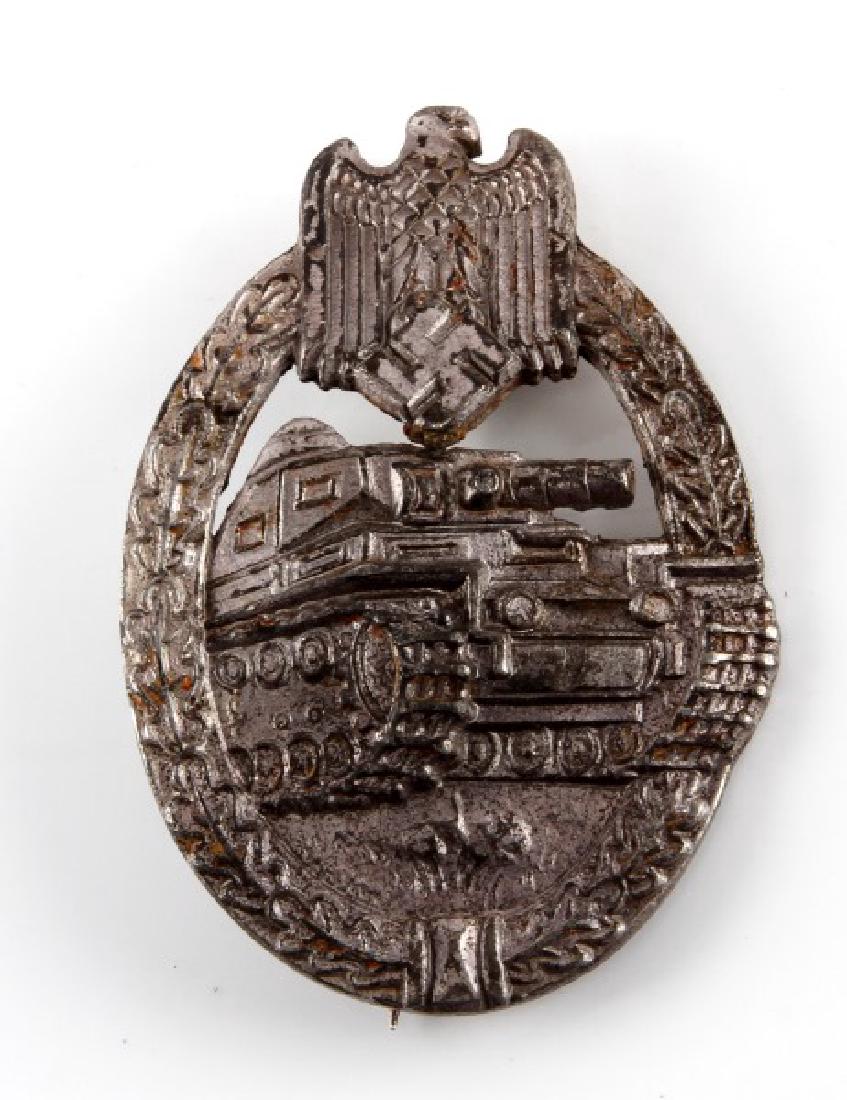 WWII GERMAN HEER PANZER ASSAULT BADGE IN SILVER: German WWII late war Panzer Assault badge. Silver class. Makers mark on reverse. Thin vertical pin back. Tarnishing as expected with age.