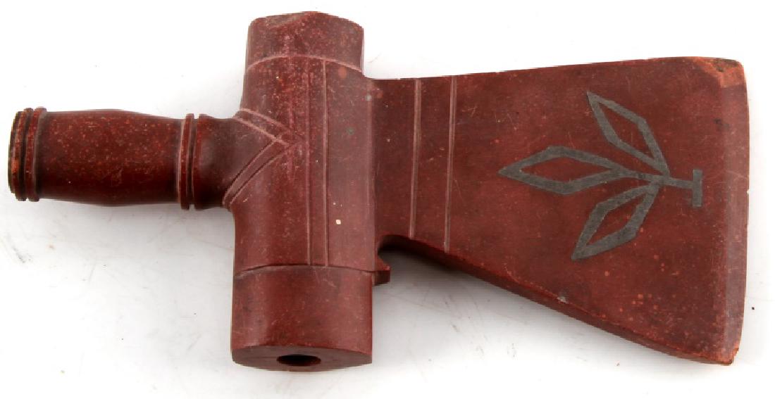 7 INCH ANTIQUE CATLANITE PIPE AXE HEAD: 7" antique catlanite pipe axe head. Accented with silver markings on both sides of axe head. A few small chips and scratches. Some pencil writing. Interesting piece in very good condition. Comes in ri