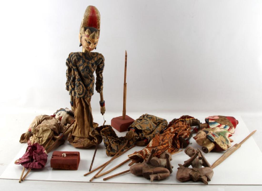 LOT OF 4 ANTIQUE INDONESIAN WAYANG SHADOW PUPPETS: Four, in very good condition. With some age and wear, heads may need some repair. They measure approximately 20" long. Comes with a pair of wooden wall hangers.