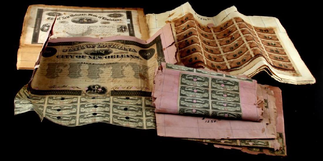 LOT ANTIQUE OBSOLETE STATE OF LOUISIANA BONDS: From Louisiana/City of New Orleans. Includes assessment bonds and more. Most bonds have been glued to sheets of paper. All bonds in fair to good condition. Sheets of paper bonds are glued to are in po