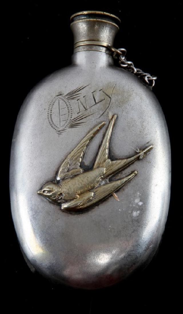 SILVER PLATE VICTORIAN FLASK WITH BIRD: Front is marked "Only". Measures 4 inches in length. Overall very good condition.