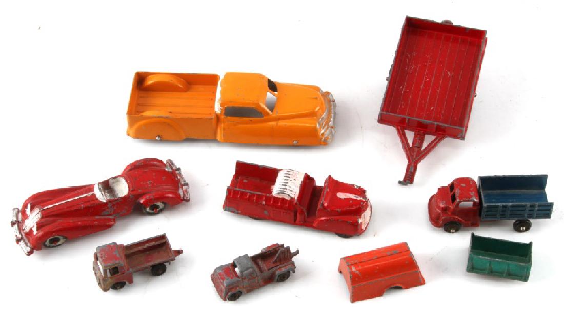 LOT 7 ANTIQUE METAL TOY CARS MANOIL TOOTSIE HUBLEY: Race car, fire truck, flatbeds, and more. 2 extra pieces included as well. Age wear and some paint loss present. Toys range from 2 3/8" - 6" in length.
