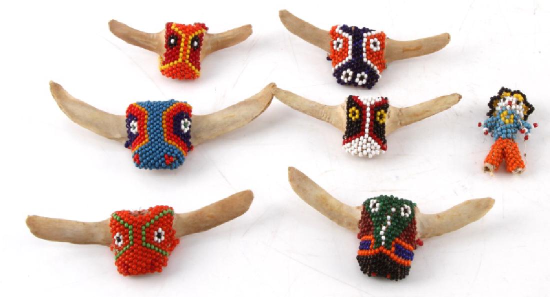 7 VINTAGE BEAD & BONE NATIVE AMERICAN FETISH LOT: Each piece is bone/vertabrae with beaded animal face design. Also includes small beaded human figure. Fetishes range in size from approx. 3" - 4 1/2". All in very good condition and come in rike. r mo