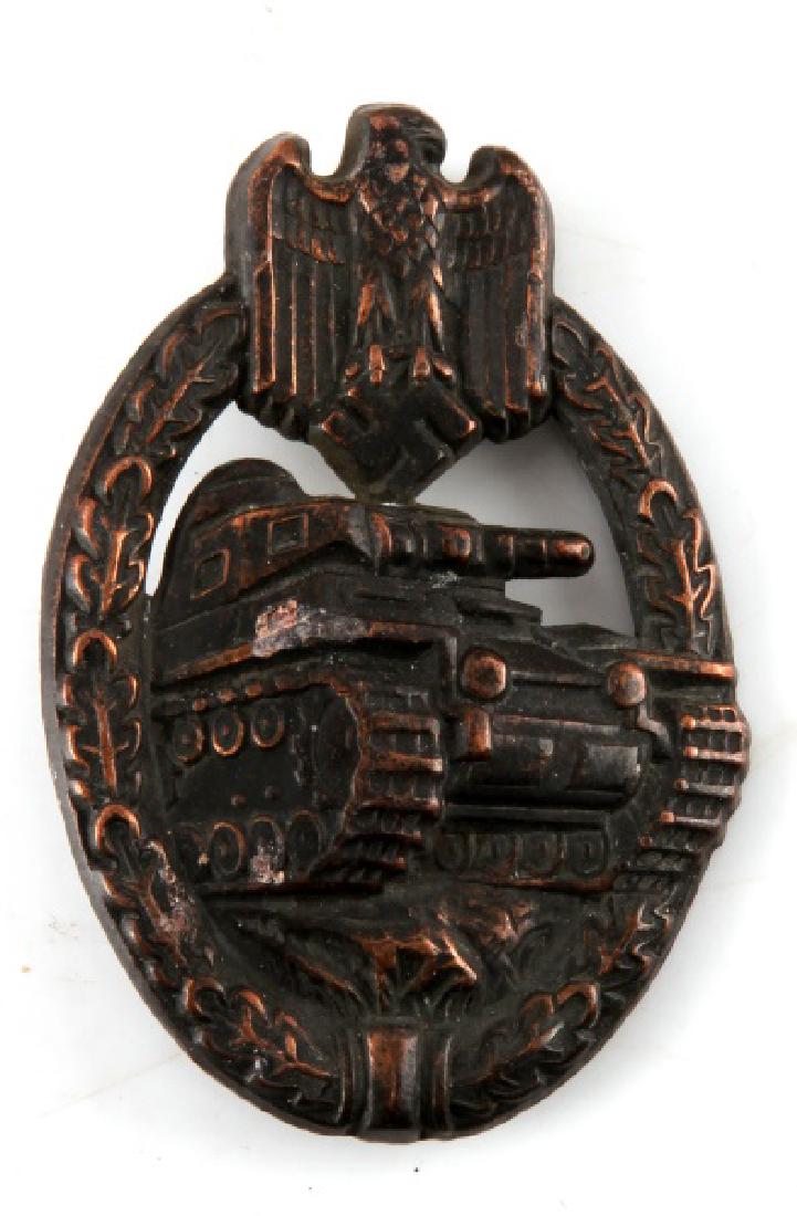 GERMAN WWII PANZER ASSAULT BADGE BRONZE UNMARKED: German WWII Panzer Assault badge in bronze. Unmarked version. Hook on reverse is bent. Normal tarnishing. VG condition.