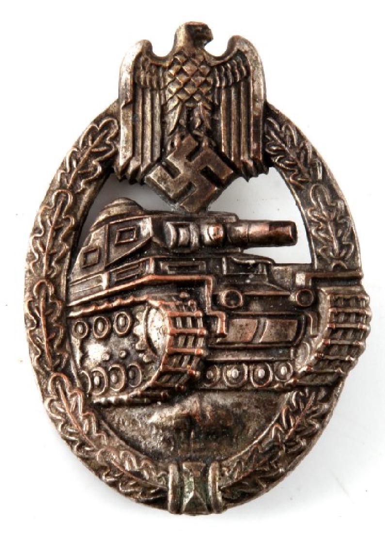 GERMAN WWII PANZER ASSAULT BADGE IN SILVER: German WWII Panzer Assault badge in silver. Pin loop has been bent and closed. Minor tarnishing. VG condition. Unmarked version.