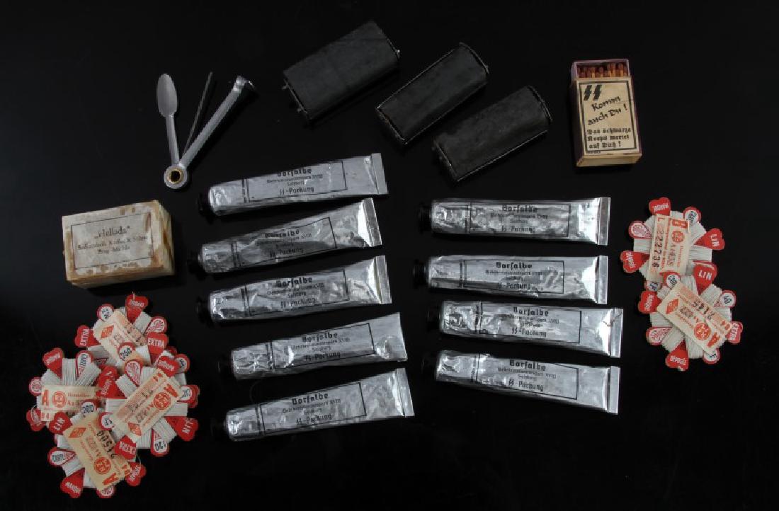 MIXED LOT GERMAN WWII SOAP OINTMENT MATCHES ETC: Mixed lot of WWII German SS items includes nine (9) tubes of ointment (used), three (3) rollers, one (1) bar of soap, one (1) box of matches, one (1) box of spooled thread, one (1) metallic tool. All 