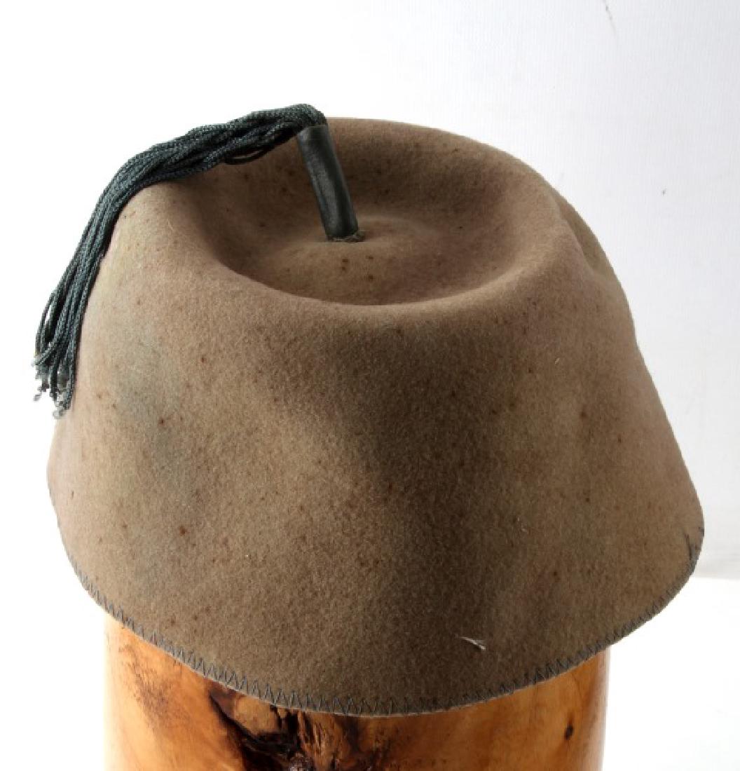 5TH WARD USVF MILITARY FEZ US VISITING FORCES: Vintage 5th Ward United States Visiting Forces (USVF) military fez with top tassel. Some spot discoloration and some light mothing. Inside sweatband liner is ripped but intact. Item in fair to good co