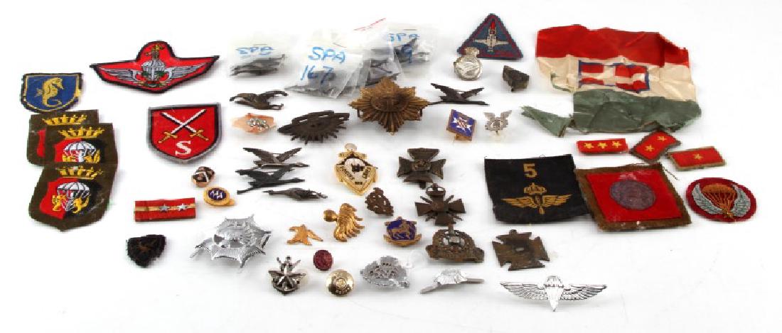 VINTAGE MULTI CONFLICT BADGE & PATCH LOT: Vintage lot of multi-conflict badges & patches. Includes WWI German military cross, German Infantry School, Australian Commonwealth military forces, WWI Royal Corps Army Ordinance cap badge, GCMA Cent