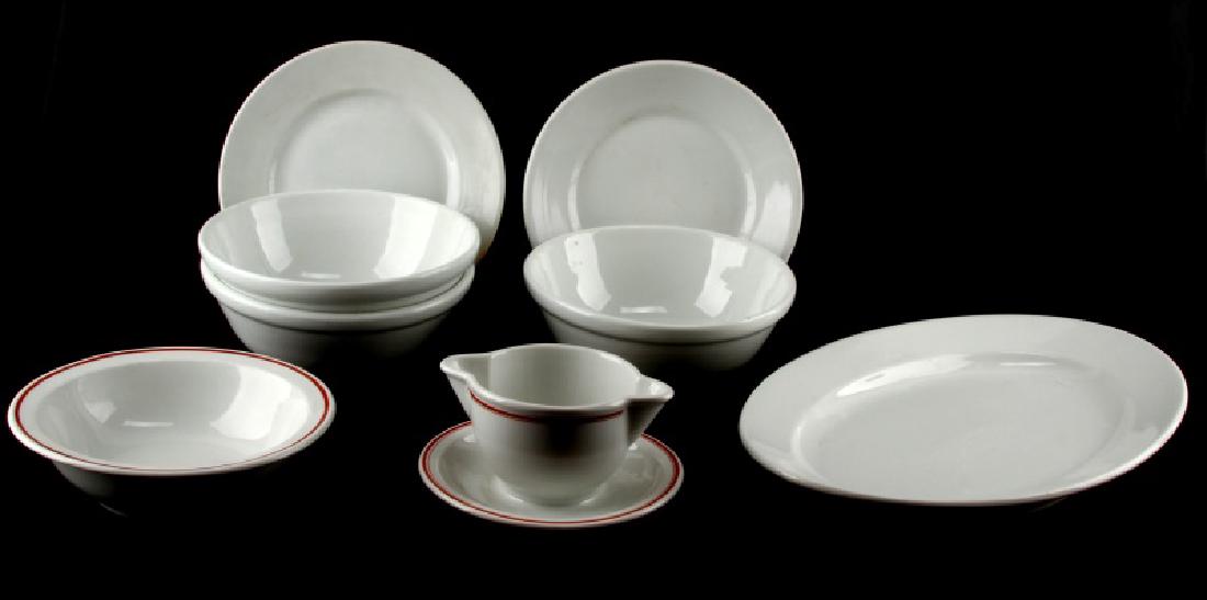 WWII GERMAN MILITARY MESS HALL CHINA DINNERWARE: Lot of 8 includes platter, 2 plates, 3 medium serving bowls along with a condiment dish and side dish with red accent. All in various years and German Third Reich marks.