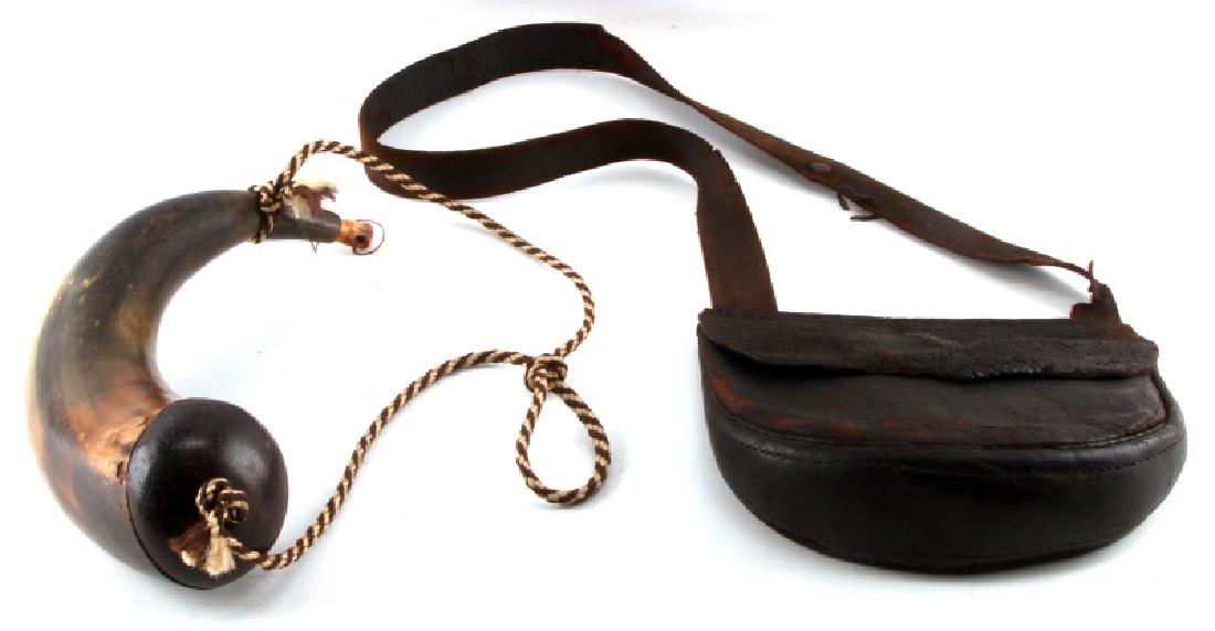 17 INCH ANTIQUE POWDER HORN W LEATHER AMMO BAG: Horn size is approximate and measured on the curve. Nice coloring/finish to horn. End stopper included. Rob may not be original. 9 3/8" x 8 1/4" antique leather ammo bag is heavily worn with rips and