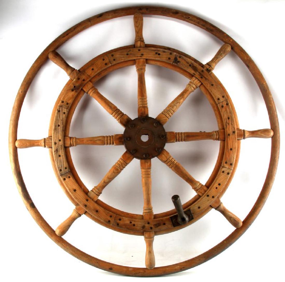 ANTIQUE MARITIME NAUTICAL WOOD & METAL SHIP WHEEL: Large, 46 inch diameter, Antique Captains wheel, unvarnished and in very good condition. Metal has rust patina and brass assist handle is in very good condition. A nice example of maritime equipment.