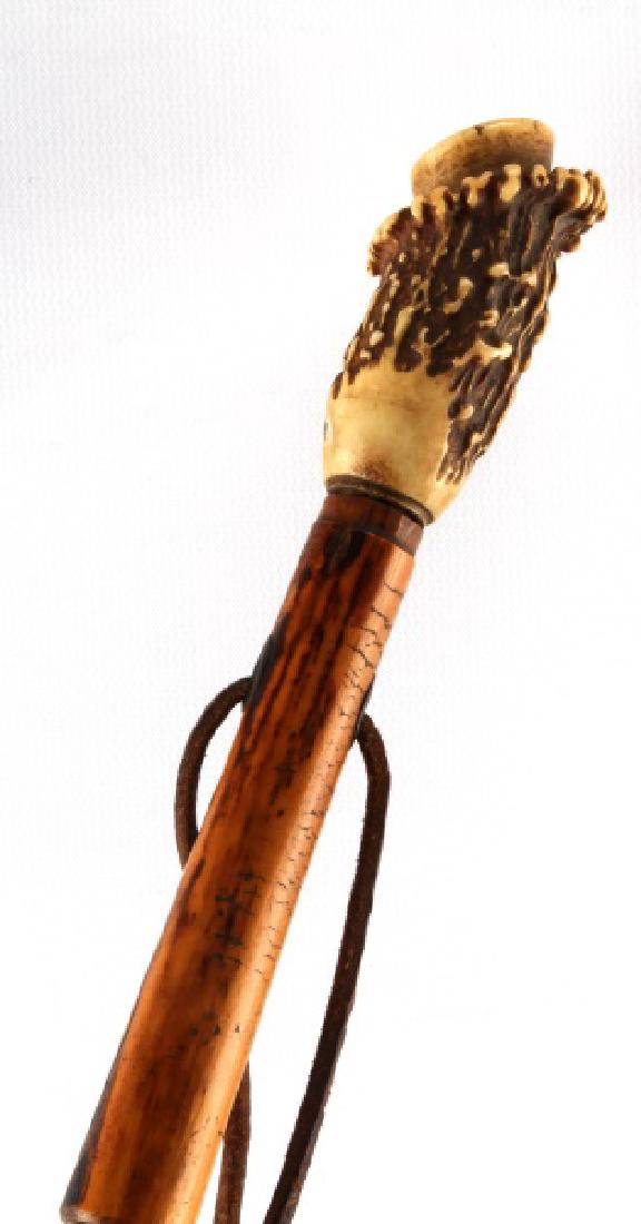 ANTIQUE ANTLER HANDLE DAGGER CANE WALKING STICK: Antique dagger cane with a stag antler handle. In very good condition, with leather wrist strap and original ferrule. Overall cane measures 36 1/2 inches, the dagger around 20 inches, and the blade 13
