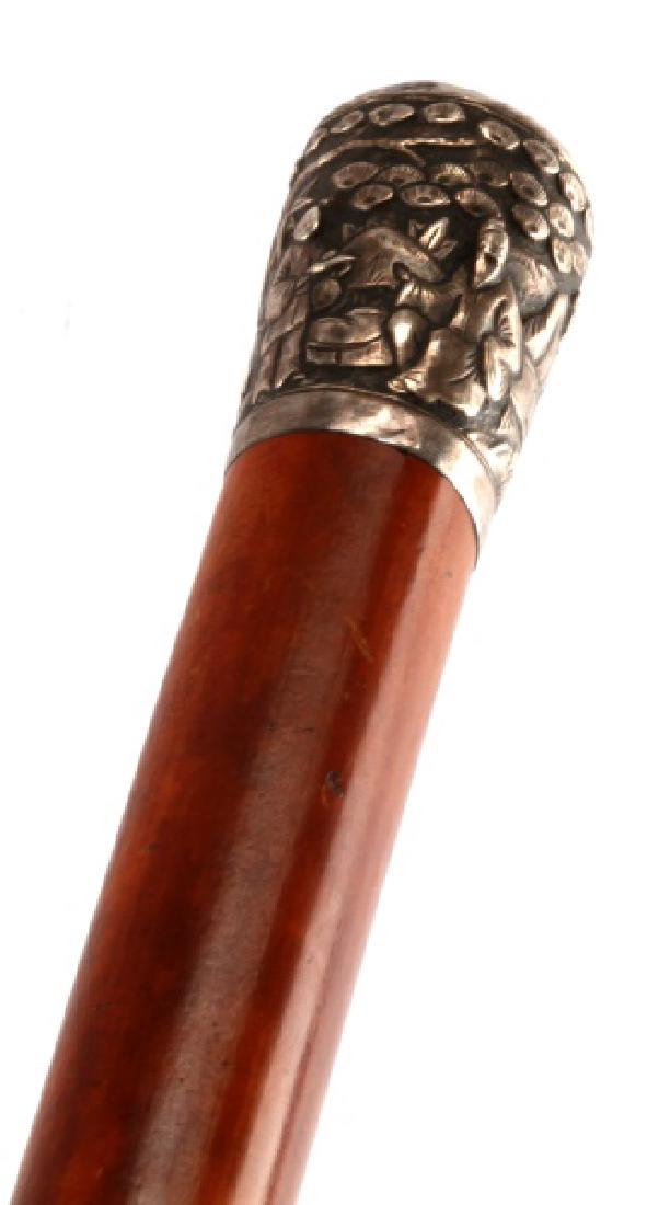 ANTIQUE SILVER HANDLE SWORD CANE WALKING STICK: Antique sword cane with a silver handle. Design on the handle appears to be an East Asian rural setting. Measures 36 inches in overall length, with the sword measuring 34 inches and the blade 28 inche