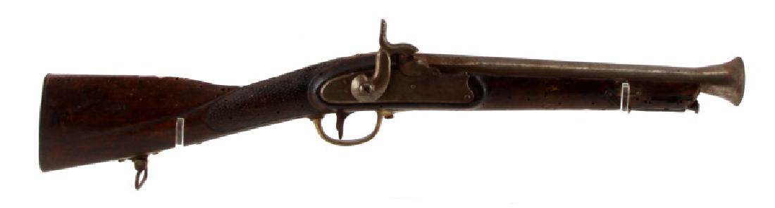 EARLY 19TH C PERCUSSION COACH GUN FLARED MUZZLE: Circa 1800-1820. Flared steel barrel measures 12.5 inches, engraved lock plate, brass accents, and wood stock. Ramrod present. Metal butt pad. Mottled dark patina with pitting, rusted bore, and termit